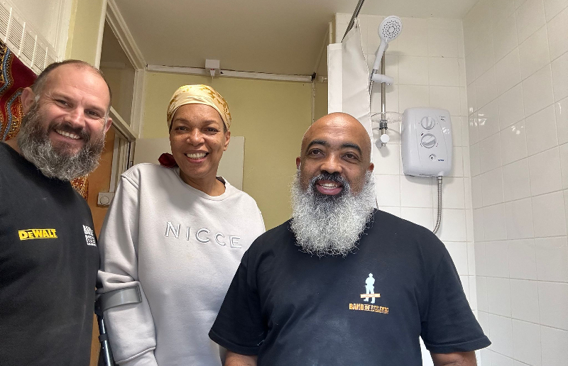 Charity volunteers complete bathroom project and receive a shower of thanks 