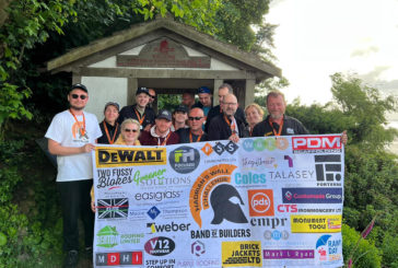 Volunteer walkers raise more than £20,000 for Band of Builders